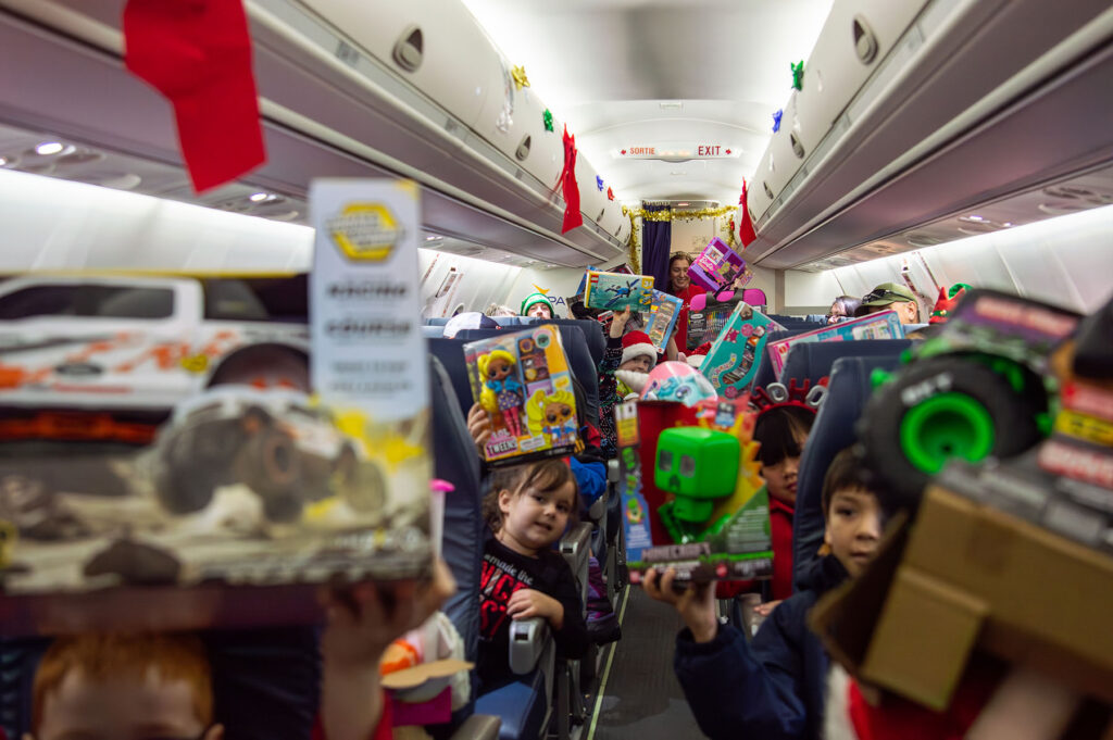Children with presents on their flight to the North Pole